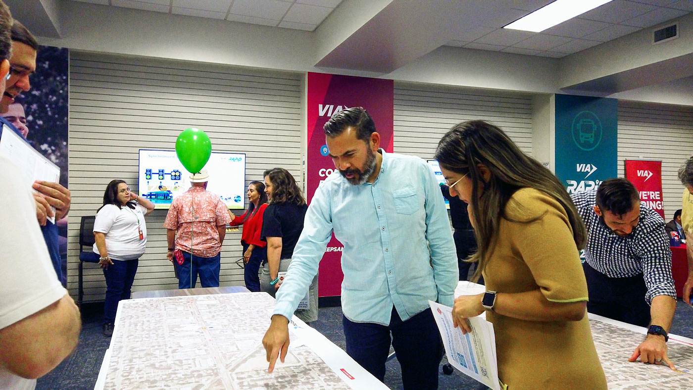 Photo of community members visiting the VIA Rapid project office